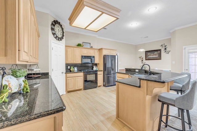 5502 Sundance Ct, Midland, TX 79707 - kitchen with black appliances, light brown cabinetry, ornamental molding, light wood-style flooring, and a sink