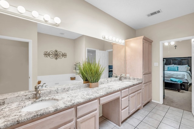 5502 Sundance Ct, Midland, TX 79707 - bathroom featuring connected bathroom, double vanity, tile patterned flooring, and a garden tub