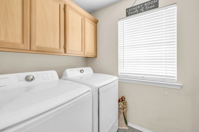 5502 Sundance Ct, Midland, TX 79707 - washroom with washing machine and dryer and cabinet space