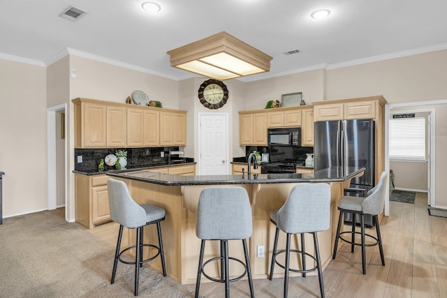 5502 Sundance Ct, Midland, TX 79707 - kitchen featuring light brown cabinets, black appliances, a kitchen bar, crown molding, and decorative backsplash