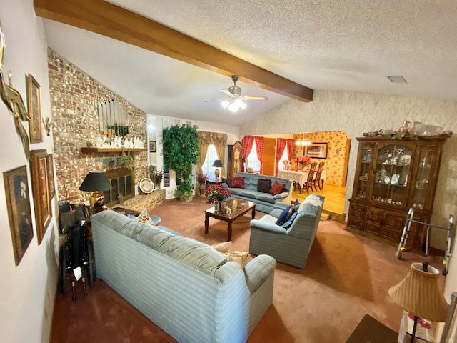 carpeted living room with lofted ceiling with beams, ceiling fan, a textured ceiling, and a brick fireplace