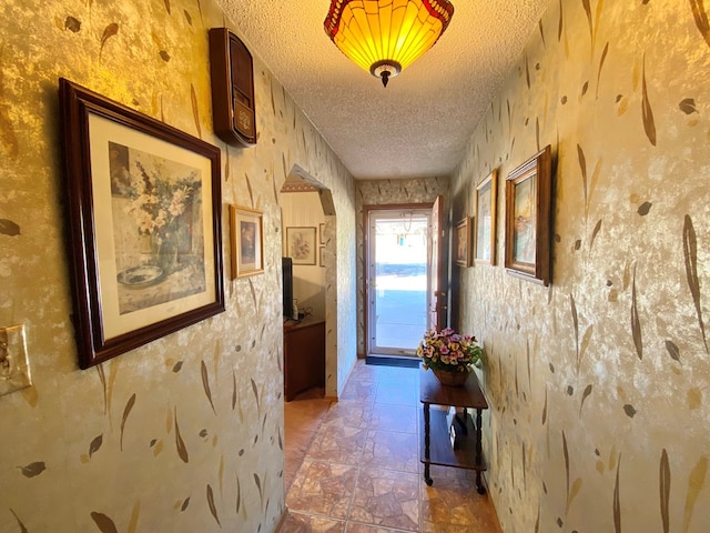 hallway featuring a textured ceiling