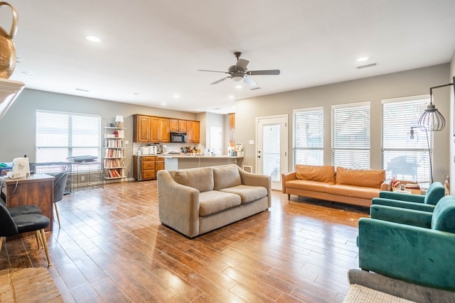 3505 Coquina Ln, Midland, TX 79707 - living area with a ceiling fan, healthy amount of natural light, light wood finished floors, and recessed lighting