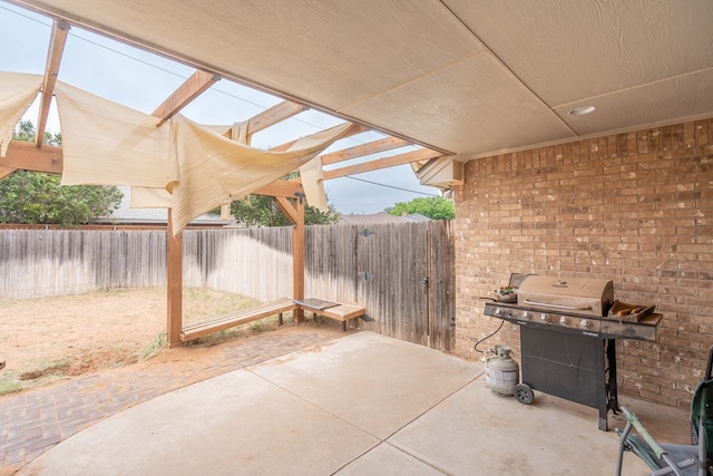 3505 Coquina Ln, Midland, TX 79707 - fenced backyard with a patio, a pergola, and area for grilling