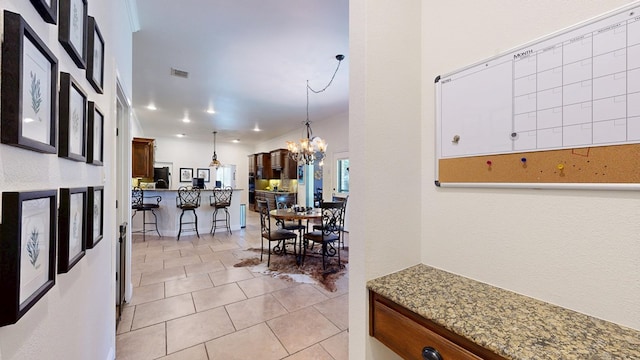 hall featuring recessed lighting, a chandelier, light tile patterned floors, and visible vents
