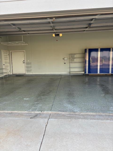 900 Keystone Ct, Midland, TX 79705 - garage featuring a garage door opener