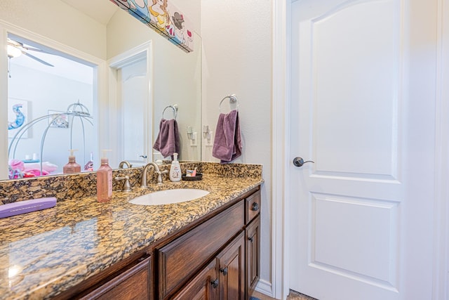 bathroom with a ceiling fan and vanity