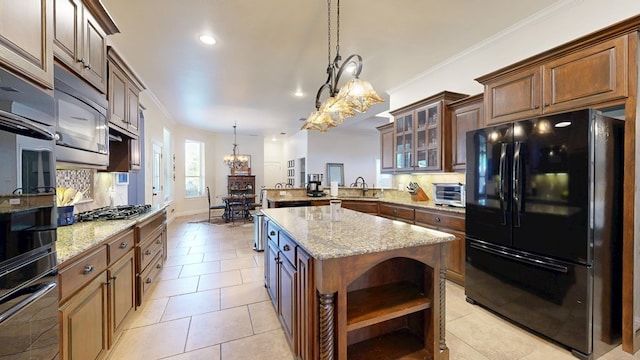 kitchen with open shelves, a notable chandelier, black appliances, and tasteful backsplash