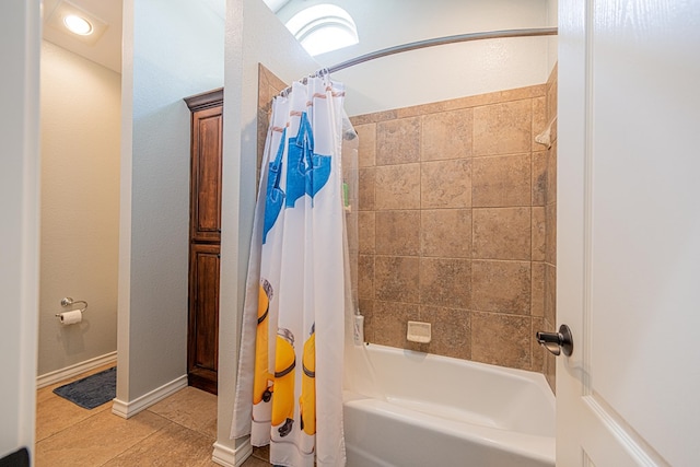full bath with tile patterned floors, baseboards, and shower / bathtub combination with curtain