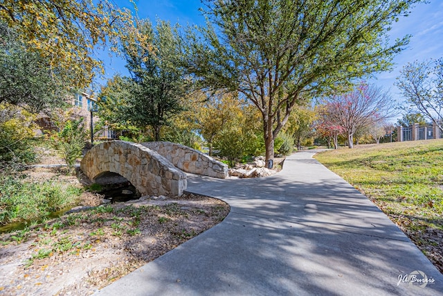 view of street featuring concrete driveway