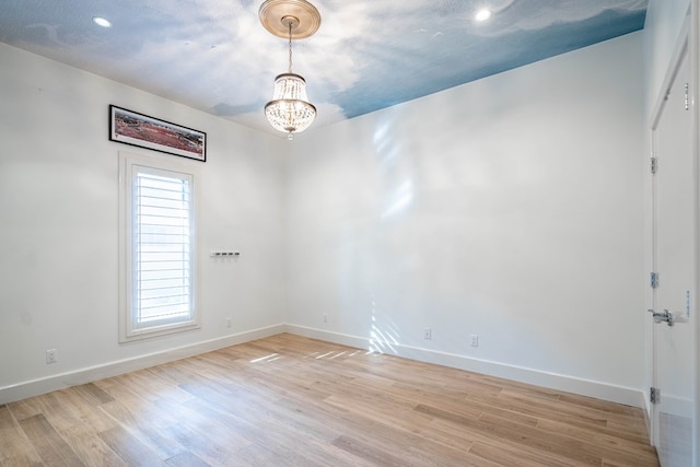 15 Lakes Dr, Midland, TX 79705 - unfurnished room with light wood finished floors, a chandelier, and recessed lighting