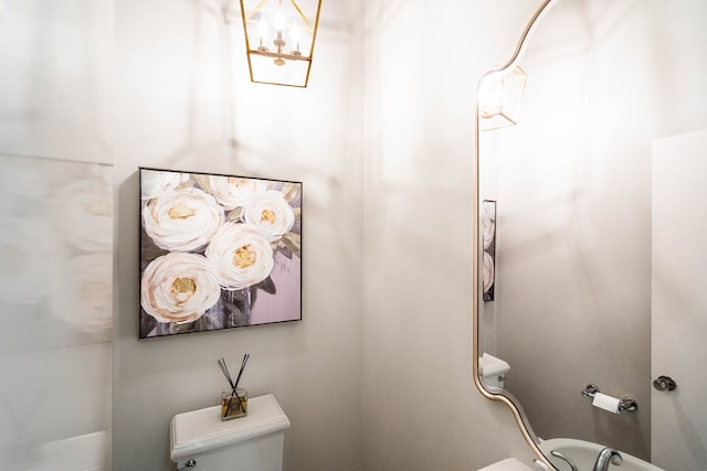 15 Lakes Dr, Midland, TX 79705 - bathroom featuring toilet and a chandelier