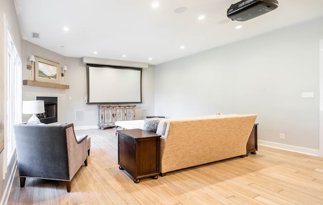 15 Lakes Dr, Midland, TX 79705 - cinema with light wood finished floors, a fireplace, and recessed lighting