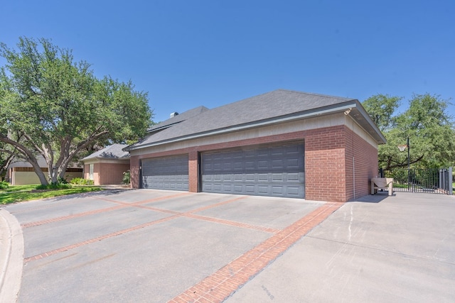15 Lakes Dr, Midland, TX 79705 - view of side of property with brick siding, a garage, and concrete driveway