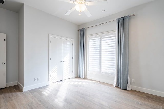 15 Lakes Dr, Midland, TX 79705 - unfurnished bedroom with light wood-style flooring, a closet, and a ceiling fan