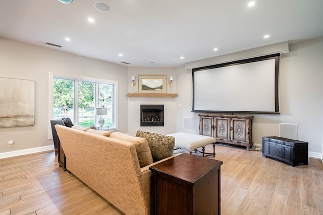 15 Lakes Dr, Midland, TX 79705 - cinema room featuring a fireplace, light wood-style flooring, and recessed lighting