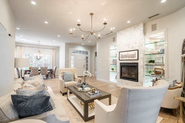15 Lakes Dr, Midland, TX 79705 - living area with a chandelier, a fireplace, recessed lighting, and light wood finished floors