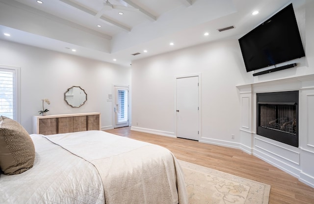 15 Lakes Dr, Midland, TX 79705 - bedroom featuring a high ceiling, light wood-style floors, recessed lighting, beam ceiling, and multiple windows