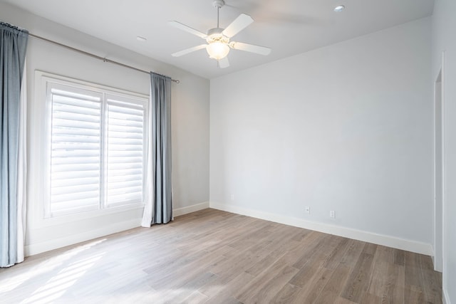 15 Lakes Dr, Midland, TX 79705 - empty room featuring wood finished floors, plenty of natural light, and ceiling fan
