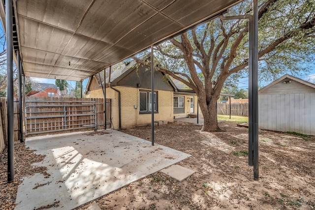 view of patio / terrace featuring a shed