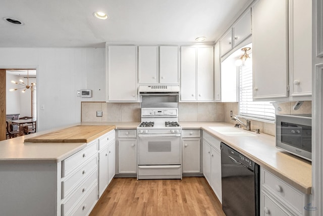 kitchen featuring dishwasher, white cabinetry, sink, white gas range, and light wood-type flooring