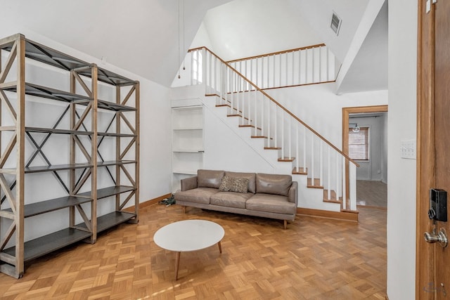 interior space featuring high vaulted ceiling and parquet floors