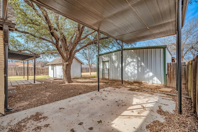 view of patio / terrace with a storage shed