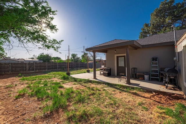 view of yard with a patio and a fenced backyard