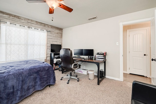 bedroom with carpet flooring, a ceiling fan, baseboards, and visible vents