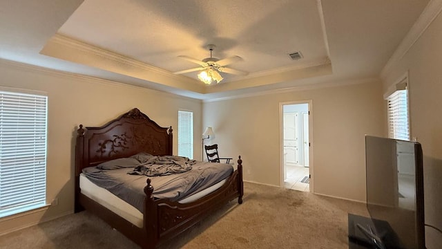 4804 Bishops Castle Dr, Midland, TX 79705 - bedroom featuring a tray ceiling, carpet, crown molding, and a ceiling fan