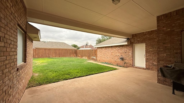 4804 Bishops Castle Dr, Midland, TX 79705 - fenced backyard with a patio