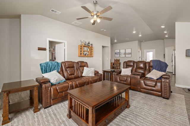 living area with visible vents, lofted ceiling, baseboards, recessed lighting, and a ceiling fan