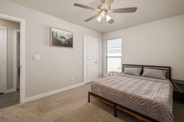 bedroom with baseboards, ceiling fan, and carpet