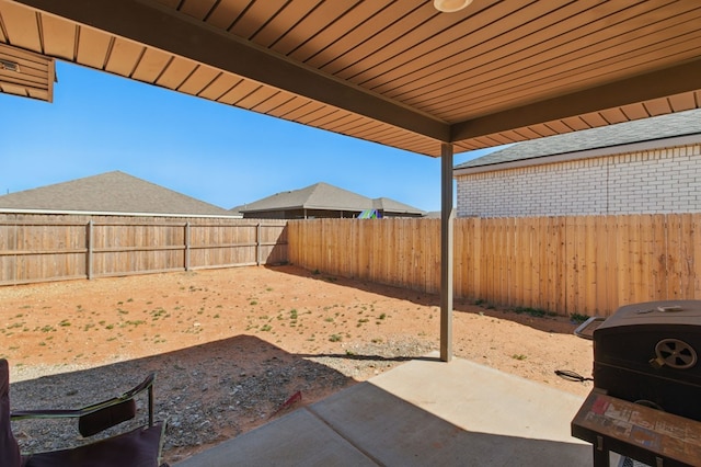 view of yard with a fenced backyard and a patio