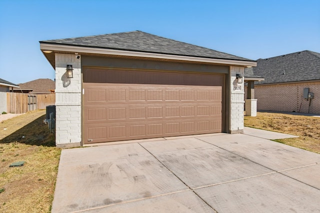 exterior space featuring fence and concrete driveway
