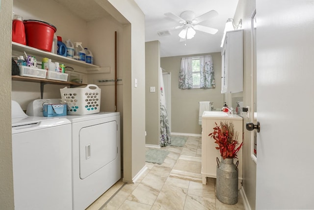 601 E 1st St, Coleman, TX 76834 - laundry room featuring washing machine and dryer, light marble finish floors, and ceiling fan