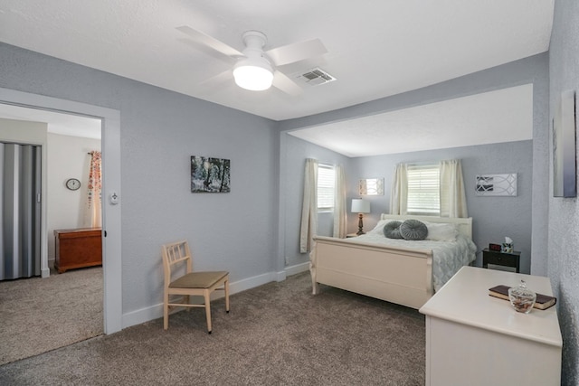 601 E 1st St, Coleman, TX 76834 - carpeted bedroom with a ceiling fan and baseboards