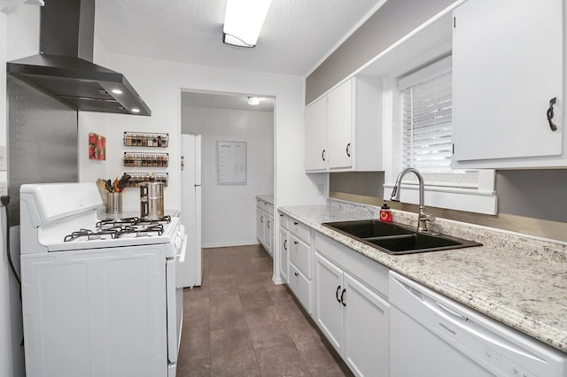 601 E 1st St, Coleman, TX 76834 - kitchen with white appliances, wall chimney exhaust hood, and white cabinetry