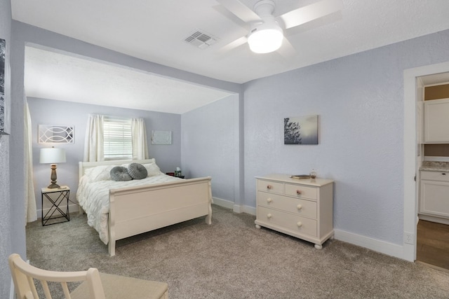 601 E 1st St, Coleman, TX 76834 - carpeted bedroom featuring baseboards and a ceiling fan