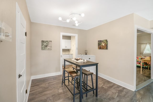 601 E 1st St, Coleman, TX 76834 - dining room featuring a chandelier and baseboards