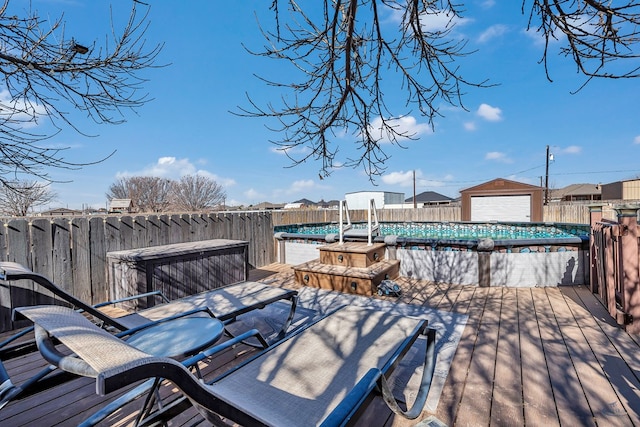 deck with a fenced in pool