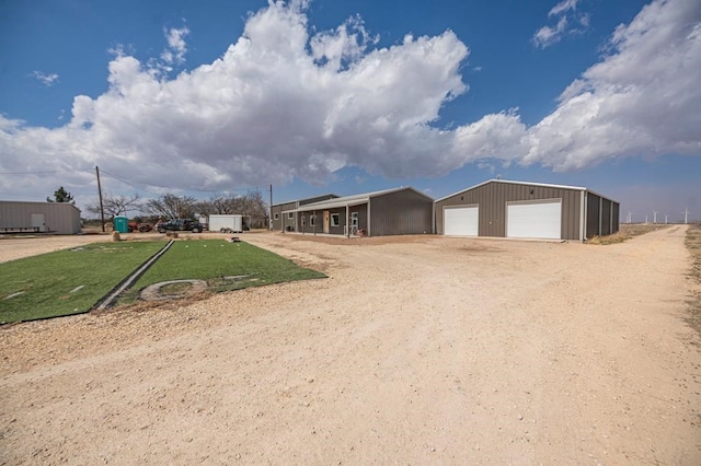 view of front of house with an outbuilding and a garage