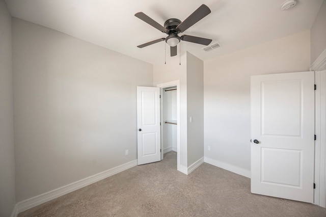 unfurnished bedroom with ceiling fan, light carpet, and vaulted ceiling