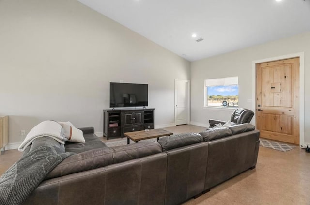 living room with high vaulted ceiling