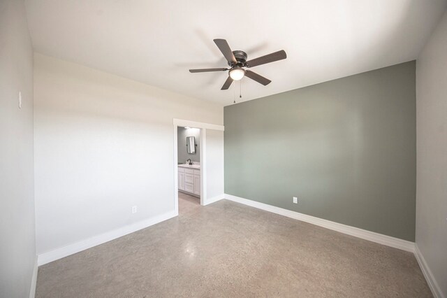 unfurnished room with ceiling fan and sink