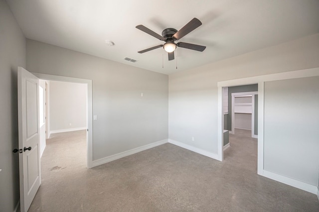 spare room featuring light colored carpet and ceiling fan