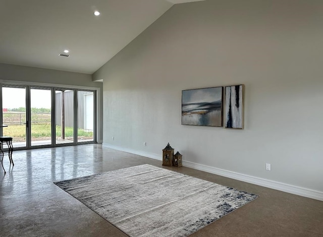 empty room featuring high vaulted ceiling