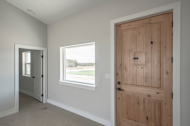 entryway featuring light carpet