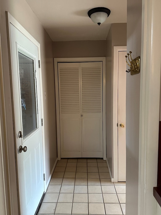 hallway featuring light tile patterned floors