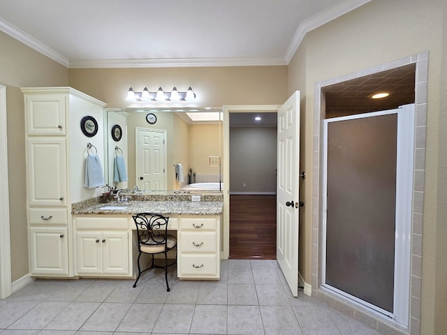 4808 W Cherrywood Ct W, Midland, TX 79707 - bathroom with crown molding, a stall shower, vanity, tile patterned floors, and baseboards